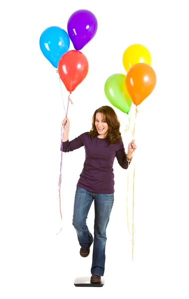 Casual: Frau versucht mit Luftballons abzunehmen — Stockfoto