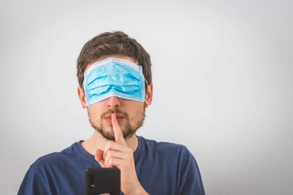 Young Angry Man Face Mask Eyes Doing Psst Gesture — Stock Photo, Image