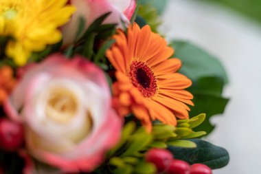 Close up of spring flower bouquet with gerbera and roses