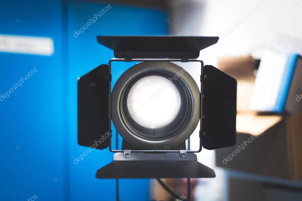 Professional studio spotlight in a TV studio. Lighting equipment for photography or videography. 