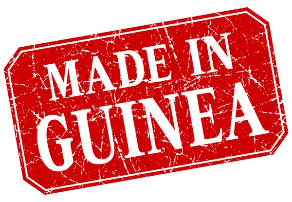 Vyrobené v Guineji Rudé náměstí grunge razítko — Stockový vektor