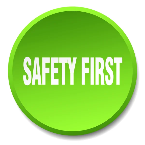 Безопасность первый зеленый круглый плоский изолированная кнопка — стоковый вектор