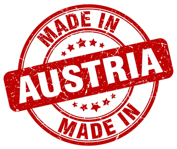 Made in Austria red grunge round stamp — Stock Vector