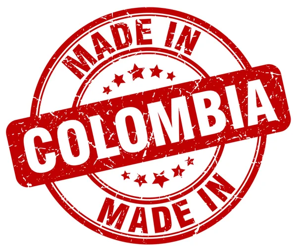Maakte in Colombia rode grunge ronde stempel — Stockvector