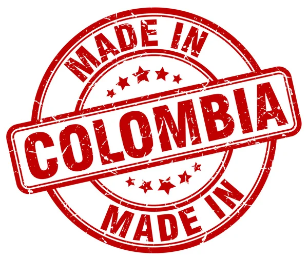 Maakte in Colombia rode grunge ronde stempel — Stockvector