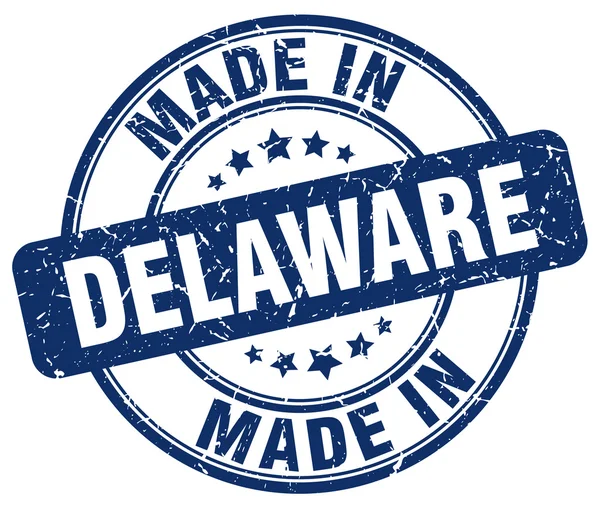 Made in Delaware blue grunge round stamp — Stock Vector
