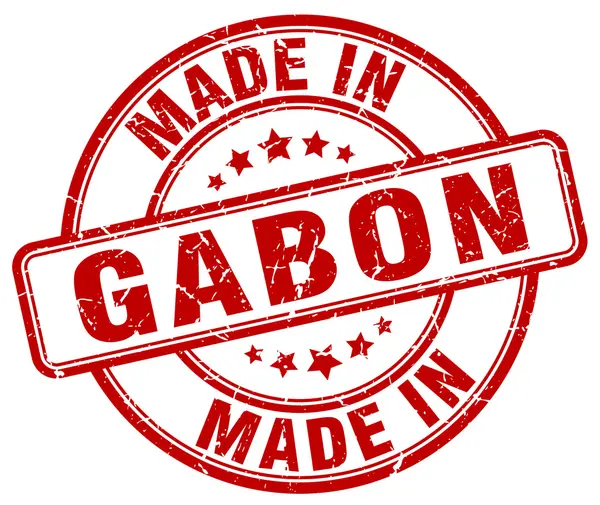Made in Gabon red grunge round stamp — Stock Vector