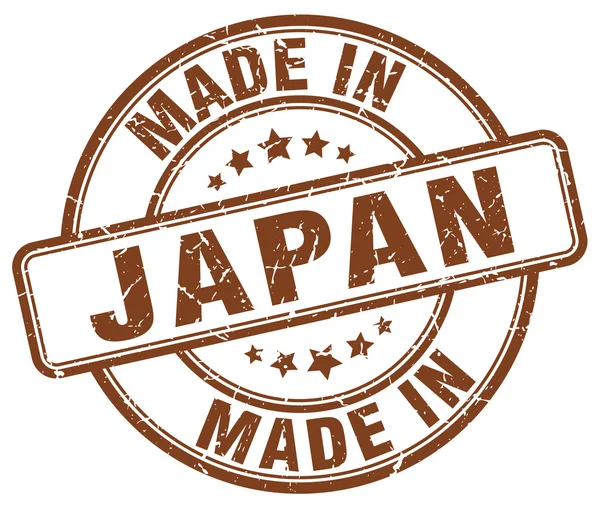 Зроблено в Японії коричневий гранж круглі штамп — стоковий вектор