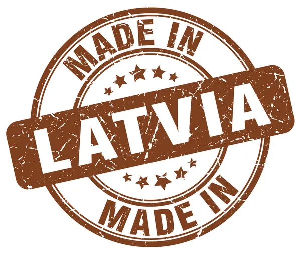 Зроблено в Латвії коричневий гранж круглі штамп — стоковий вектор
