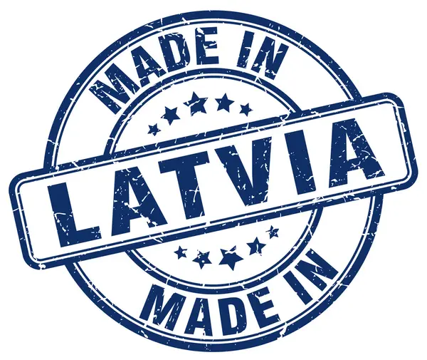 Made in Lettland blå grunge rund stämpel — Stock vektor
