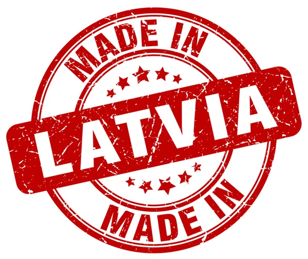 Made in Latvia red grunge round stamp — Stock Vector