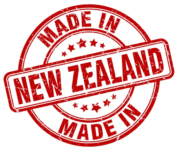 Wykonane w grunge nowozelandzki czerwony okrągły znaczek — Wektor stockowy
