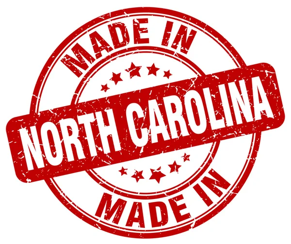 Maakte in North Carolina rode grunge ronde stempel — Stockvector