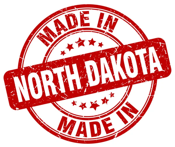 Made in North Dakota red grunge round stamp — Stock Vector