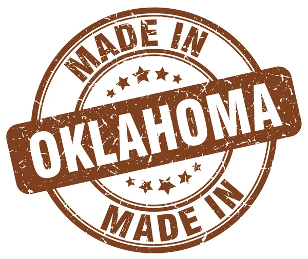 Fabriqué en Oklahoma timbre rond marron grunge — Image vectorielle