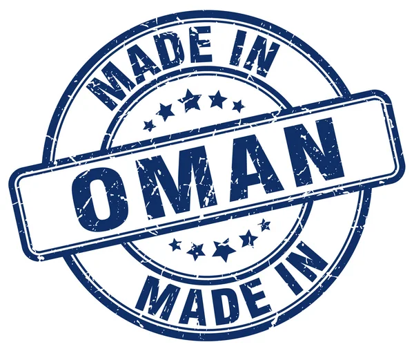 Made in Oman blue grunge round stamp — Stock Vector