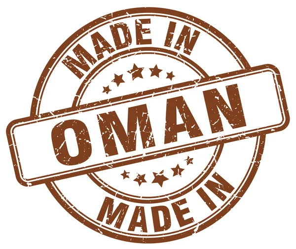 Vyrobené v Ománu hnědé grunge kulaté razítko — Stockový vektor