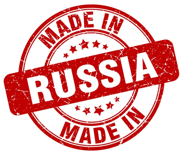 Maakte in Rusland rode grunge ronde stempel — Stockvector