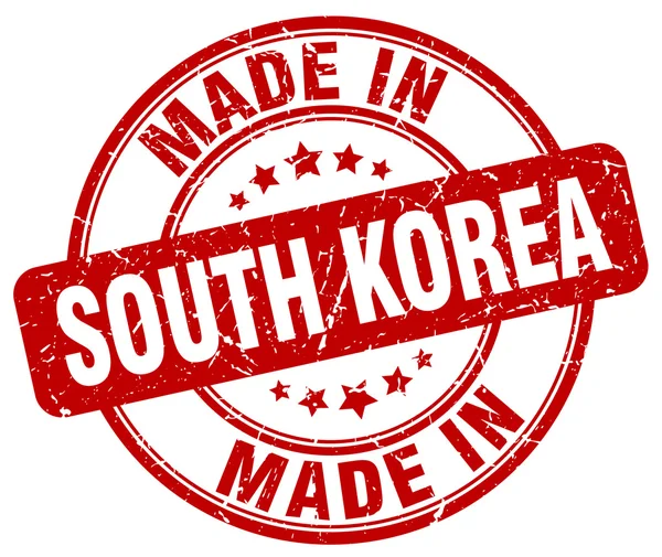 Made in South Korea red grunge round stamp — Stockvektor