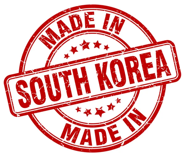 Made in South Korea red grunge round stamp — Stockvektor