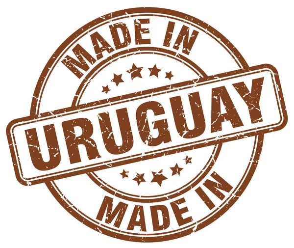 Hecho en Uruguay grunge marrón redondo sello — Archivo Imágenes Vectoriales