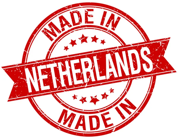 Gyártott-ban Hollandia piros kerek vintage bélyegző — Stock Vector