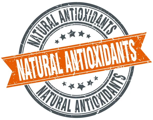 Antiossidanti naturali rotondo arancione grungy vintage isolato timbro — Vettoriale Stock