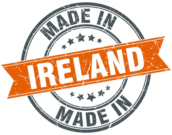 Ruban grunge orange Irlande timbre sur blanc — Image vectorielle