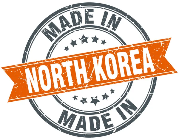 Nordkorea Orange Grunge Ribbon Stempel auf Weiß — Stockvektor