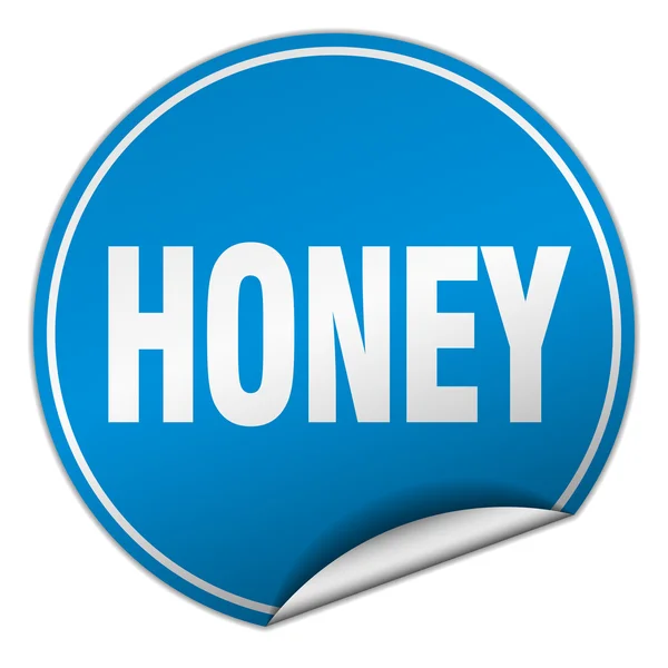 Etiqueta engomada azul redonda de miel aislada en blanco — Archivo Imágenes Vectoriales