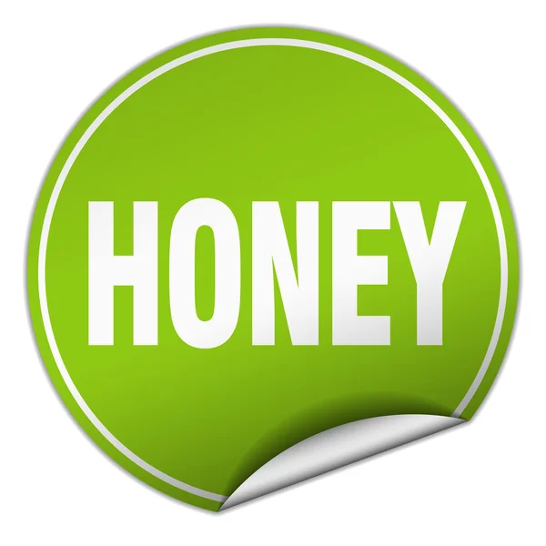 Etiqueta engomada verde redonda de miel aislada en blanco — Archivo Imágenes Vectoriales