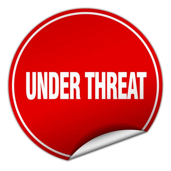 Under threat round red sticker isolated on white — Stock Vector