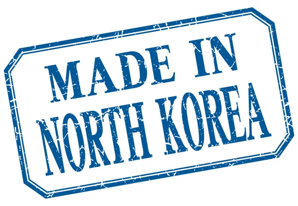 Corea del Norte - hecho en etiqueta aislada vintage azul — Archivo Imágenes Vectoriales