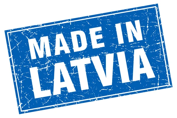 Grunge carré bleu letton fabriqué en timbre — Image vectorielle