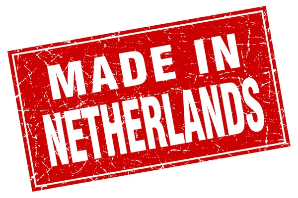 Grunge cuadrado rojo de Holanda hecho en sello — Vector de stock