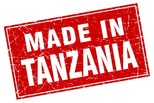 Tanzania grunge quadrato rosso fatto in francobollo — Vettoriale Stock