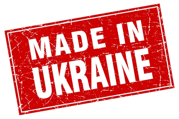 Grunge carré rouge Ukraine fabriqué en timbre — Image vectorielle