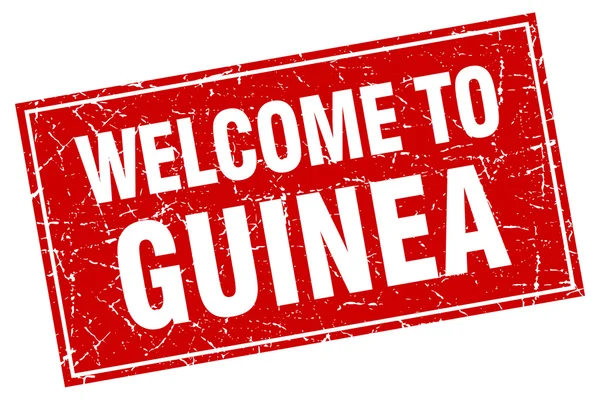 Guinea grunge quadrato rosso benvenuto a timbrare — Vettoriale Stock
