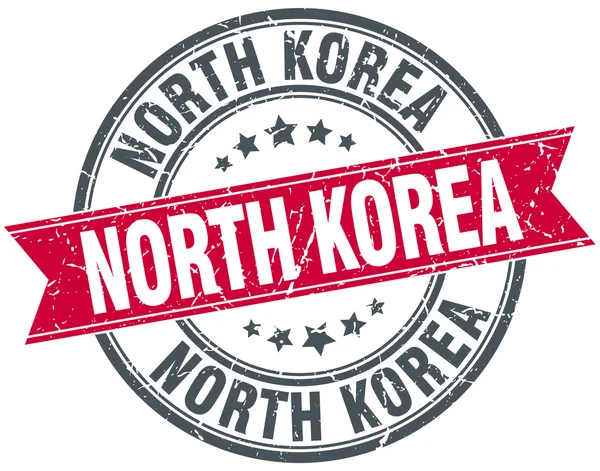 Coreia do Norte vermelho redondo grunge selo de fita vintage —  Vetores de Stock