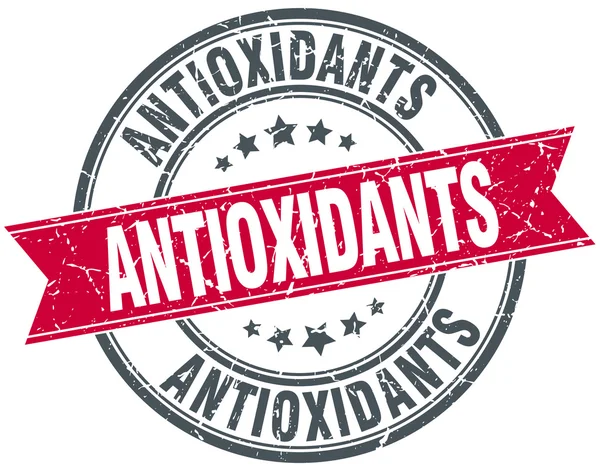 Antioxidants red round grunge vintage ribbon stamp — Stock Vector