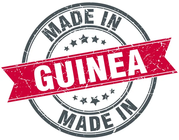 Сделанная в Гвинее красная круглая винтажная марка — стоковый вектор