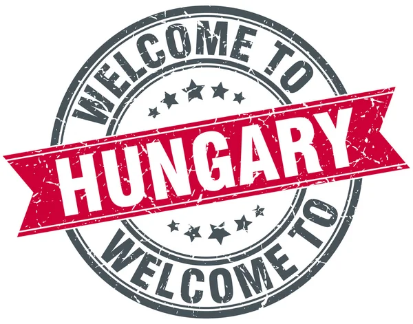 Benvenuto in Ungheria rosso rotondo timbro vintage — Vettoriale Stock
