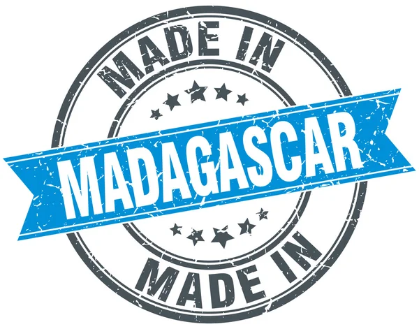 Wykonane na Madagaskarze niebieski okrągły vintage pieczęć — Wektor stockowy
