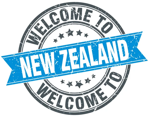 Benvenuto a Nuova Zelanda blu rotondo timbro vintage — Vettoriale Stock