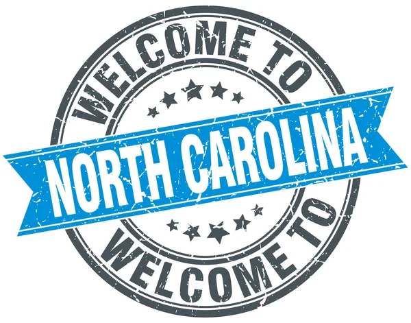 Willkommen in North Carolina blaue runde Jahrgangsmarke — Stockvektor