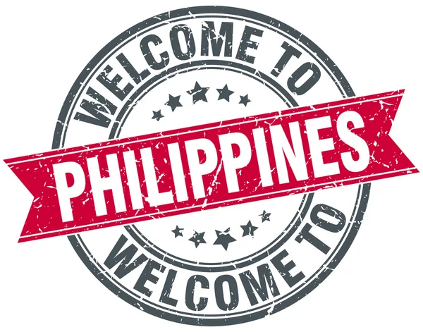 Benvenuto a Filippine rosso rotondo timbro vintage — Vettoriale Stock