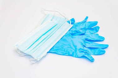 Surgical protection masks and gloves isolated on white background. Medical products for personal hygiene and the prevention of viral diseases. Coronavirus, COVID-19 pandemic, 2019-nCoV worldwide concept
