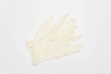 White surgical gloves isolated on white background. Medical products for personal hygiene and the prevention of viral diseases. Coronavirus, COVID-19 pandemic, 2019-nCoV worldwide concept
