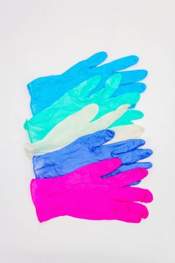 Assorted of glamour surgical gloves isolated on white background. Medical products for personal hygiene and the prevention of viral diseases. Coronavirus, COVID-19 pandemic, 2019-nCoV worldwide concept