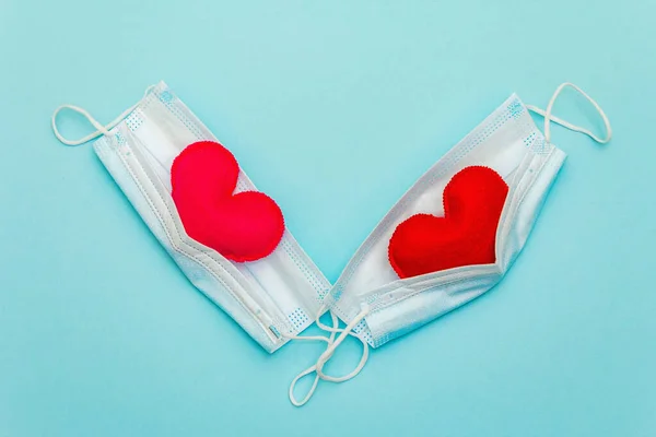 Red Pink Hearts Medical Protection Masks Light Blue Background Top — Zdjęcie stockowe